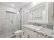 Modern bathroom featuring a glass shower, granite countertop, and white vanity at 8306 N Gomez Ave, Tampa, FL 33614