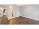 Neutral bedroom with wood-look tile flooring next to bathroom at 8306 N Gomez Ave, Tampa, FL 33614
