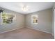 Bedroom with ceiling fan and two windows at 8306 N Gomez Ave, Tampa, FL 33614