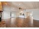 Spacious living room with vaulted ceilings, wood-look tile floors, open to kitchen at 8306 N Gomez Ave, Tampa, FL 33614