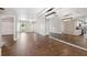 Expansive living area with wood-look tile and an open floorplan at 8306 N Gomez Ave, Tampa, FL 33614
