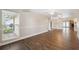 Bright living room with large window offers a view of the landscaped front yard at 8306 N Gomez Ave, Tampa, FL 33614