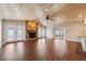 Spacious living room with vaulted ceilings, stone fireplace, and tile floors at 8306 N Gomez Ave, Tampa, FL 33614