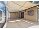 Screened patio with concrete flooring and shade cover at 8306 N Gomez Ave, Tampa, FL 33614