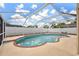 Sparkling in-ground pool in a screened enclosure at 8306 N Gomez Ave, Tampa, FL 33614