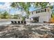 The backyard boasts a refreshing pool, lounge chairs, and an outdoor dining area for entertaining guests at 8500 144Th Ln, Seminole, FL 33776