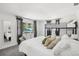 Spacious bedroom features a large bed, bunk bed, modern dresser, and view of the greenery outside at 8500 144Th Ln, Seminole, FL 33776