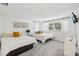A spacious bedroom with two queen beds, large windows, and ample natural light at 8500 144Th Ln, Seminole, FL 33776