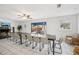 Large dining room boasts a long table, a fireplace, and sliding doors to the outdoor area at 8500 144Th Ln, Seminole, FL 33776