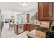 Open kitchen featuring stainless appliances, and a breakfast nook with bright natural lighting at 8500 144Th Ln, Seminole, FL 33776