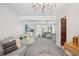 Open-concept floor plan connects to the living room, with abundant seating and a light fixture at 8500 144Th Ln, Seminole, FL 33776