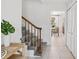 Inviting staircase leads to the upper level, and is near the entrance and a dining room at 8500 144Th Ln, Seminole, FL 33776