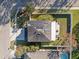 A bird's eye view reveals this home's solar panels, spacious backyard, and peaceful setting at 8607 Tidal Breeze Dr, Riverview, FL 33569