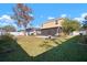 Spacious backyard with healthy green grass, and an enclosed patio at 8607 Tidal Breeze Dr, Riverview, FL 33569