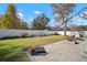 Fenced backyard with healthy green grass and a small brick patio at 8607 Tidal Breeze Dr, Riverview, FL 33569