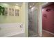 Bright bathroom features a soaking tub and glass-enclosed shower at 8607 Tidal Breeze Dr, Riverview, FL 33569
