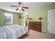 Bedroom featuring a dresser and ensuite bathroom at 8607 Tidal Breeze Dr, Riverview, FL 33569