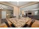 Inviting dining room with a tile-top table, seating for four, and plenty of natural light at 8607 Tidal Breeze Dr, Riverview, FL 33569