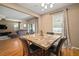 Well-lit dining room featuring a table with seating for four and hardwood flooring at 8607 Tidal Breeze Dr, Riverview, FL 33569