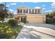 Charming two-story home with a well-manicured lawn and a two-car garage at 8607 Tidal Breeze Dr, Riverview, FL 33569