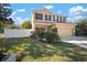 Beautifully landscaped front yard featuring lush green grass surrounding a charming home at 8607 Tidal Breeze Dr, Riverview, FL 33569
