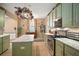 Modern kitchen boasting an island, granite countertops and stainless steel appliances at 8607 Tidal Breeze Dr, Riverview, FL 33569