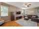 Comfortable living room with a large sofa, flat-screen TV, and stylish decor at 8607 Tidal Breeze Dr, Riverview, FL 33569