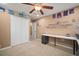 Bright home office with lots of storage space, a long desk, and wall decorations at 8607 Tidal Breeze Dr, Riverview, FL 33569