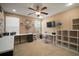 Spacious office featuring a ceiling fan, lots of desk space, and a window at 8607 Tidal Breeze Dr, Riverview, FL 33569