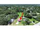 This aerial shot showcases a property surrounded by lush greenery, offering a peaceful environment at 9413 Forest Hills Dr, Tampa, FL 33612