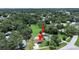 Aerial view of the home surrounded by lush greenery, showcasing its peaceful setting at 9413 Forest Hills Dr, Tampa, FL 33612