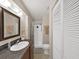 Bathroom featuring a shower with curtain and vanity with a mirror at 9413 Forest Hills Dr, Tampa, FL 33612
