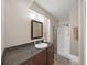 Bathroom featuring vanity and shower stall with curtain at 9413 Forest Hills Dr, Tampa, FL 33612