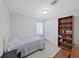 Bedroom featuring a twin bed and bookcase with decorations at 9413 Forest Hills Dr, Tampa, FL 33612