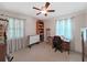 Office features sewing machine, bookshelf, and rolling craft table at 9413 Forest Hills Dr, Tampa, FL 33612