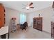 The office features tile flooring, a ceiling fan, and a desk with natural lighting at 9413 Forest Hills Dr, Tampa, FL 33612