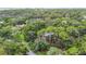 An elevated view shows this property nestled among trees in a private and serene setting at 950 Waverly St, Oldsmar, FL 34677