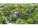 Lush aerial view of this wooded property, nestled among mature trees in a private and serene setting at 950 Waverly St, Oldsmar, FL 34677