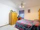 Inviting bedroom features a ceiling fan, wardrobe, and cozy atmosphere at 950 Waverly St, Oldsmar, FL 34677