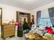 Bedroom filled with personal belongings, showcasing space and potential for customization at 950 Waverly St, Oldsmar, FL 34677