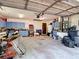 Spacious garage with built-in cabinets, tool storage, and ample room for vehicles and equipment at 950 Waverly St, Oldsmar, FL 34677