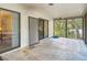 Spacious enclosed porch with sliding glass doors, offering natural light and access to the outdoors at 950 Waverly St, Oldsmar, FL 34677