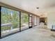 Enclosed porch with a view of the pool and backyard, providing a perfect space for outdoor relaxation at 950 Waverly St, Oldsmar, FL 34677