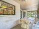Enclosed porch featuring plastic table and chairs for relaxing and entertaining guests at 950 Waverly St, Oldsmar, FL 34677