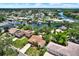 Stunning aerial view of the waterfront community with lush greenery and beautiful homes at 10732 Drummond Rd, Tampa, FL 33615