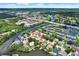 Stunning aerial view of the waterfront community with lush greenery and beautiful homes at 10732 Drummond Rd, Tampa, FL 33615