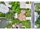 Aerial view of the home highlighting the lush greenery, beautiful canal, and private backyard at 10732 Drummond Rd, Tampa, FL 33615