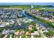 Stunning aerial view of the waterfront community with lush greenery and beautiful homes at 10732 Drummond Rd, Tampa, FL 33615