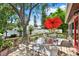 Inviting back deck with dining furniture, ideal for enjoying outdoor meals and gatherings at 10732 Drummond Rd, Tampa, FL 33615