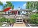 Inviting backyard deck with seating, perfect for outdoor entertaining and relaxation at 10732 Drummond Rd, Tampa, FL 33615